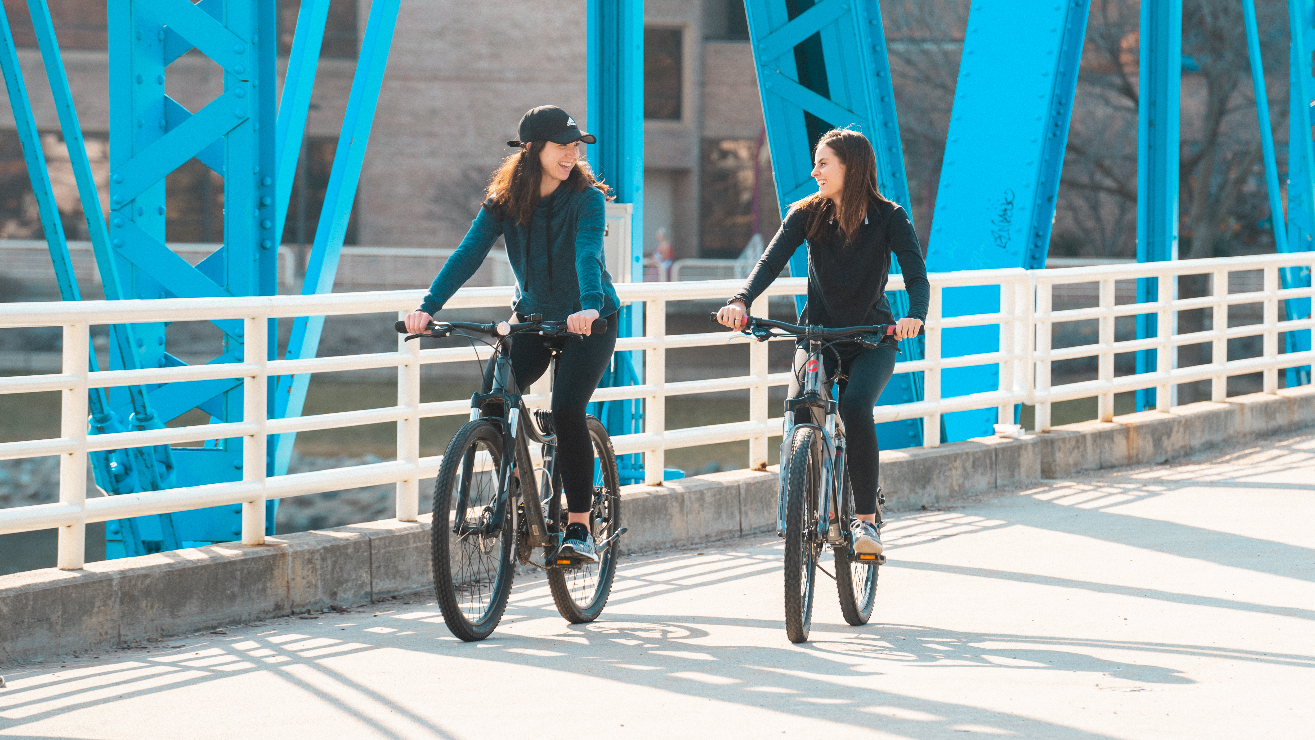 Girls biking on Blue Bridge