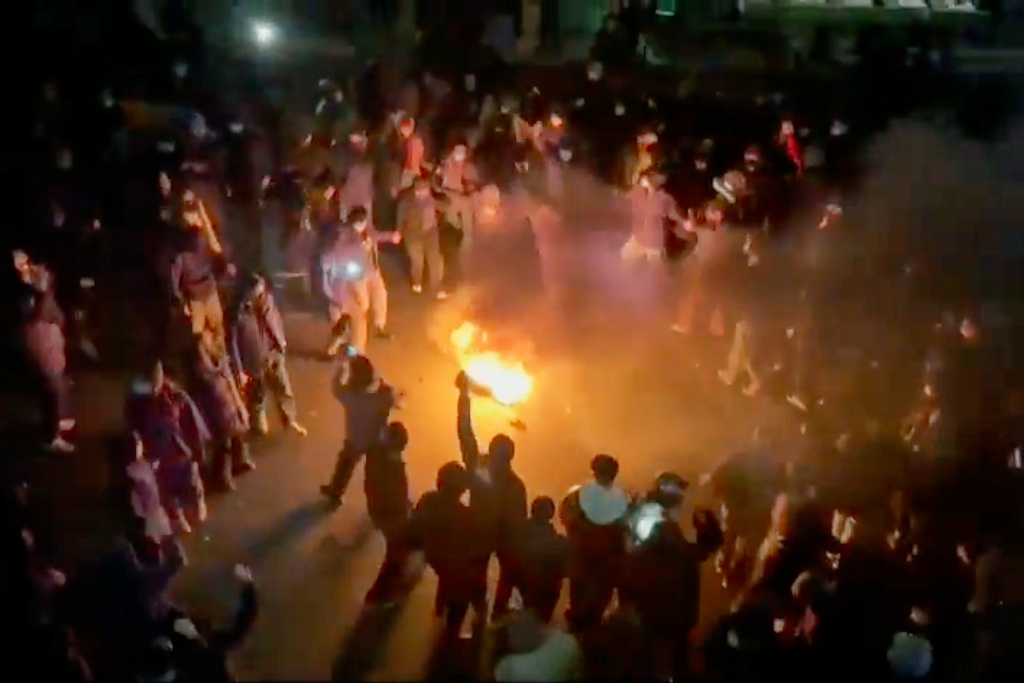 Protesters dancing and cheering around a bonfire as they take to the streets despite an intensifying crackdown as the Islamic Republic remains cut off from the rest of the world, in Tehran, Iran.