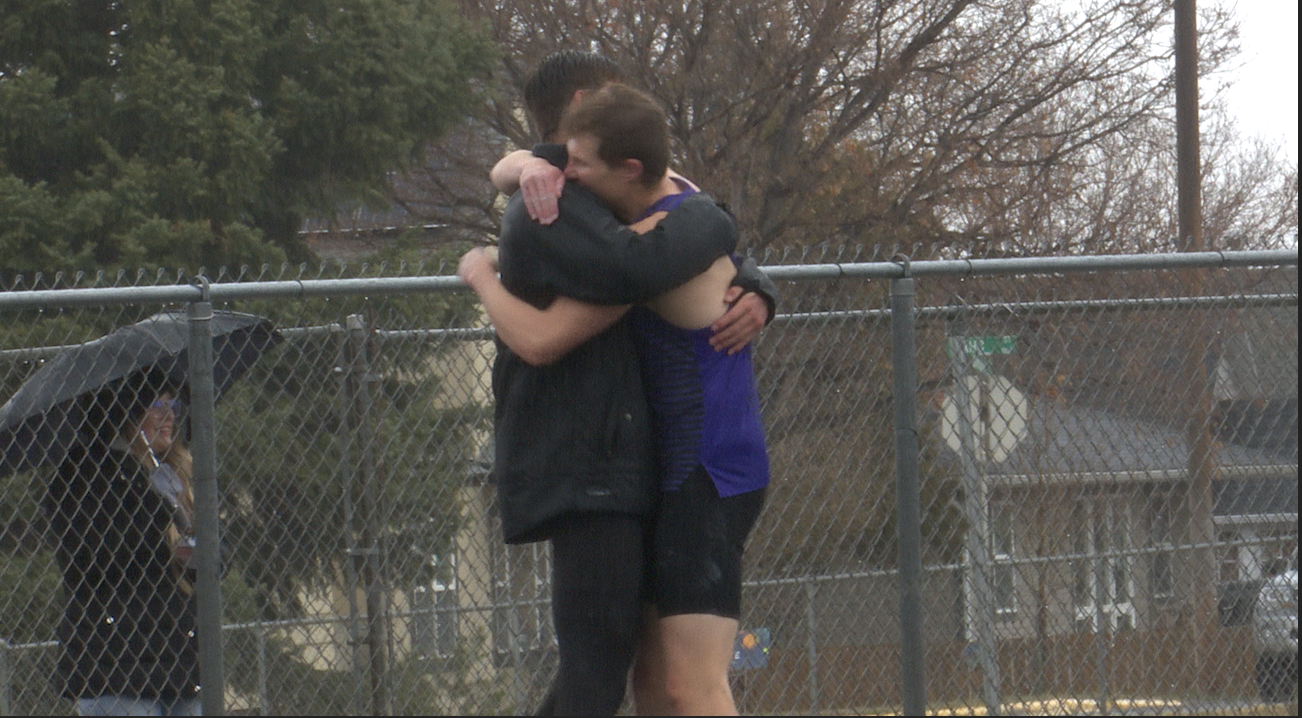 Brett Glaser & Lee Walburn hug after pole vault