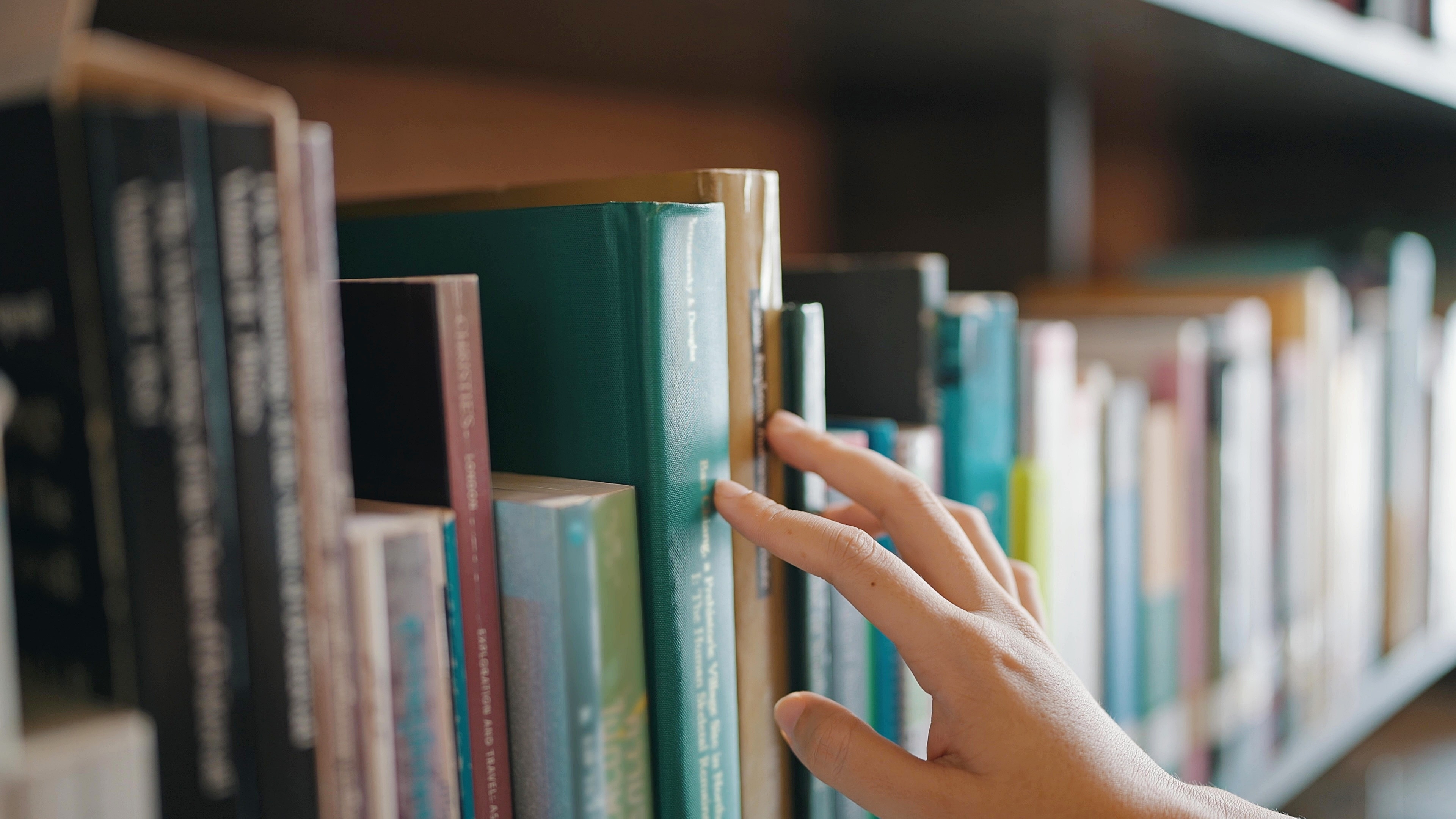 Stock image of books on a shelf.