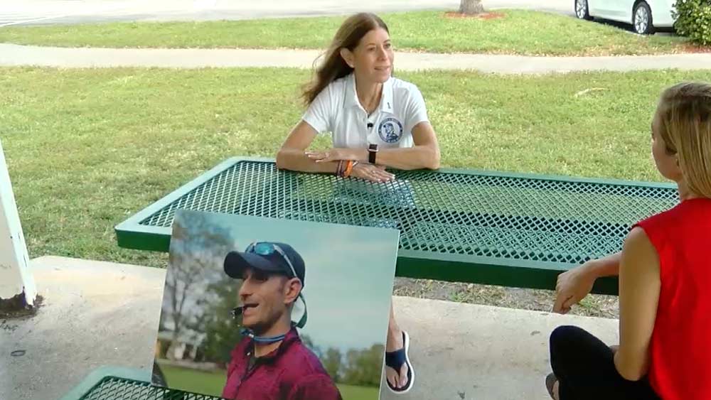 Linda Beigel Schulman with picture of son Scott Beigel, who was killed in the Parkland shooting on Feb. 14, 2018.