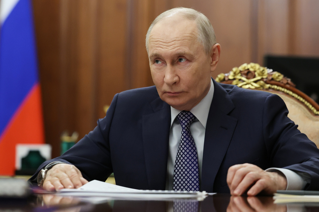 Russian President Vladimir Putin listens to Deputy Prime Minister, Chief of the Government Staff Dmitry Grigorenko during their meeting at the Kremlin, in Moscow, Thursday, April 9, 2026.