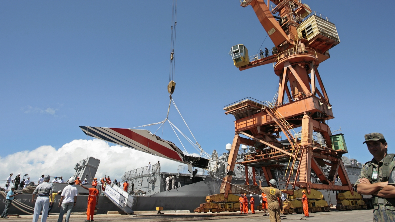 Workers unload debris belonging to the crashed Air France flight AF447.