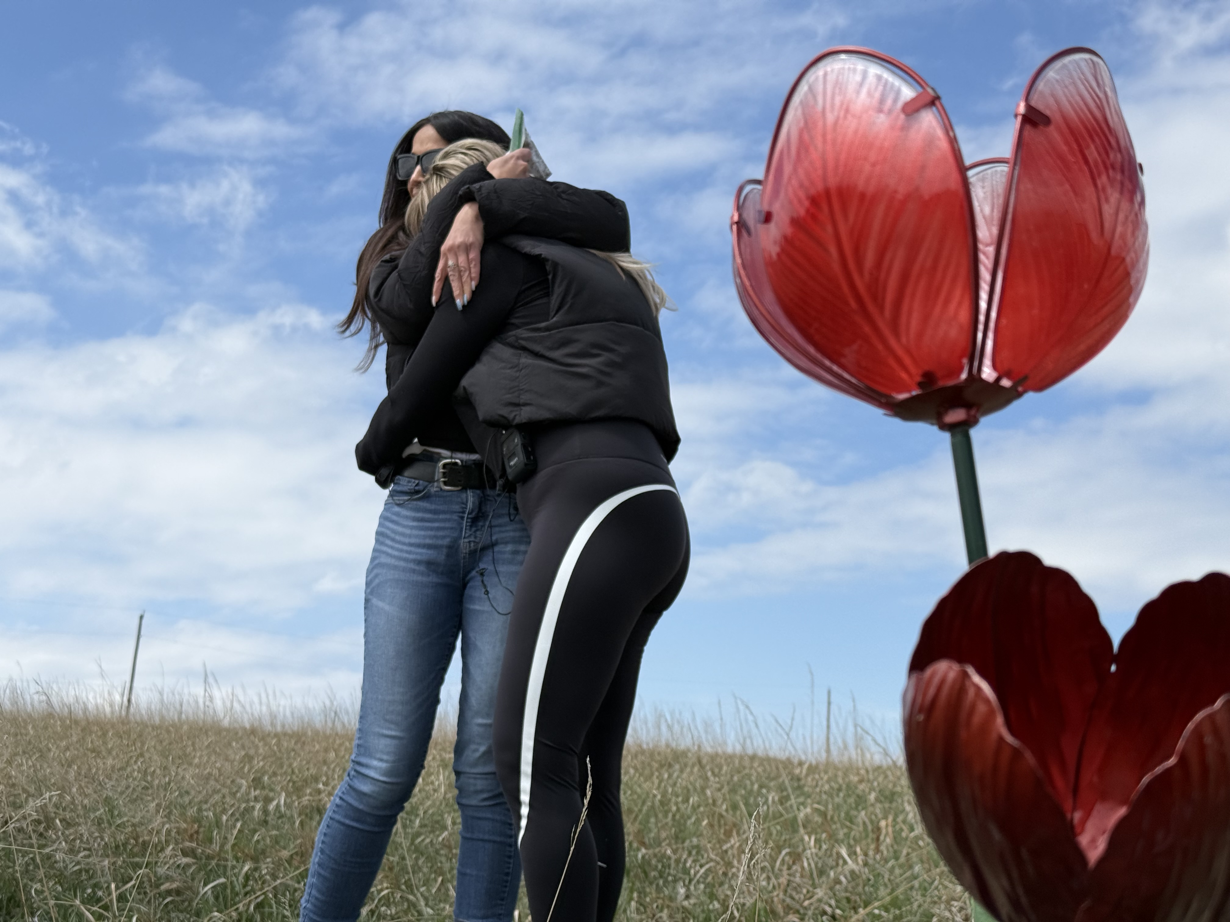 Alexa Bartell's mother Kelly and aunt Robyn Miller embrace at the site where was Alexa was found dead.