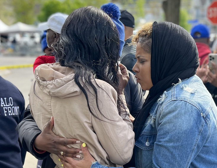 Women hug at site of Buffalo mass shooting 