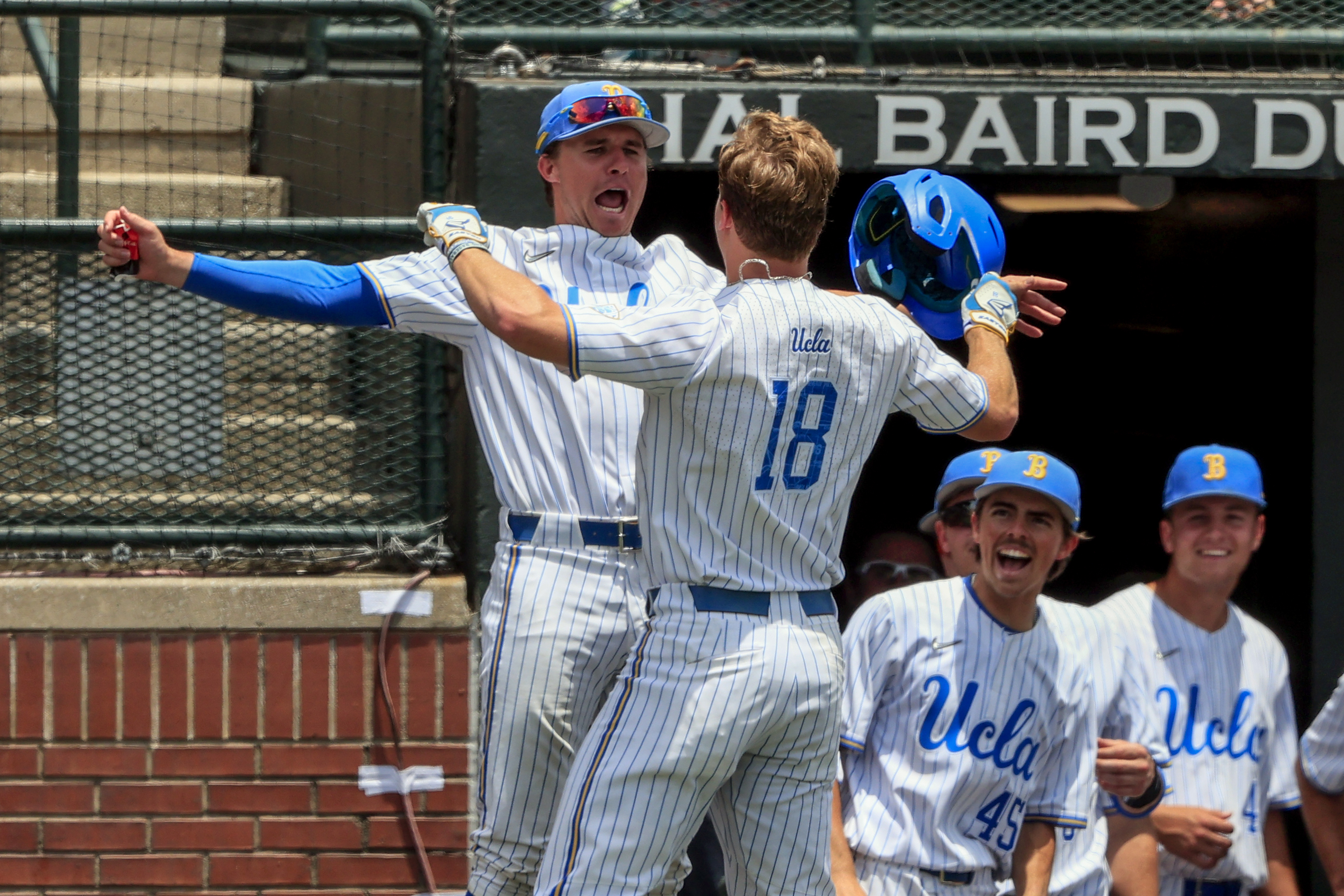 UCLA Bruins Carson Yates and Jake Moberg celebrate home run vs. Florida State Seminoles in Auburn regional, June 3, 2022