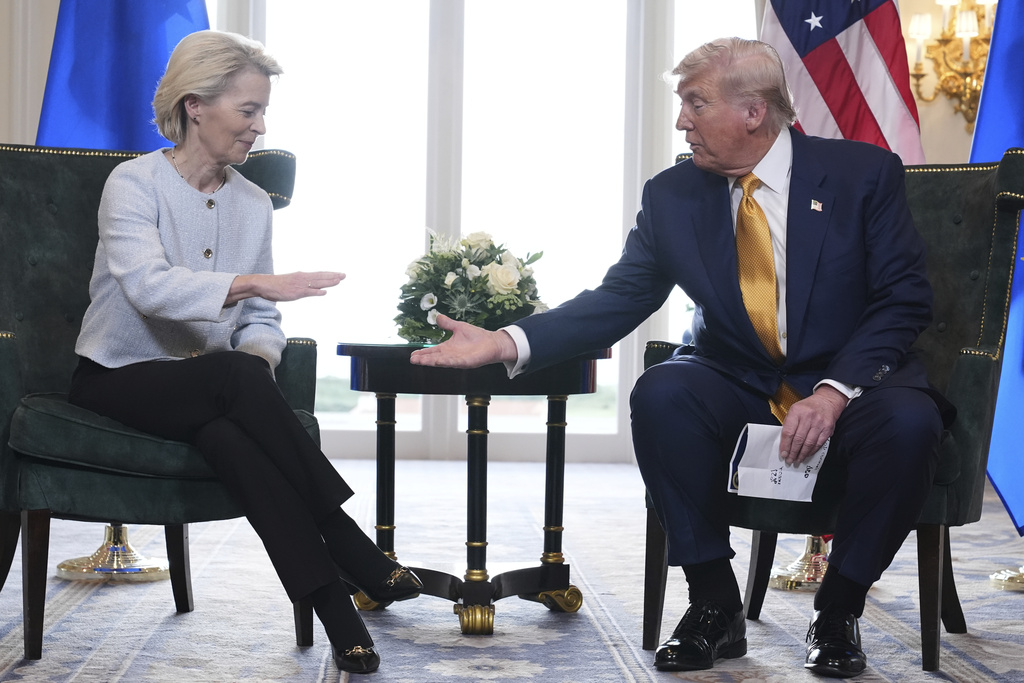 President Donald Trump and European Commission President Ursula von der Leyen shake hands after reaching a trade deal at the Trump Turnberry golf course in Turnberry, Scotland Sunday, July 27, 2025.
