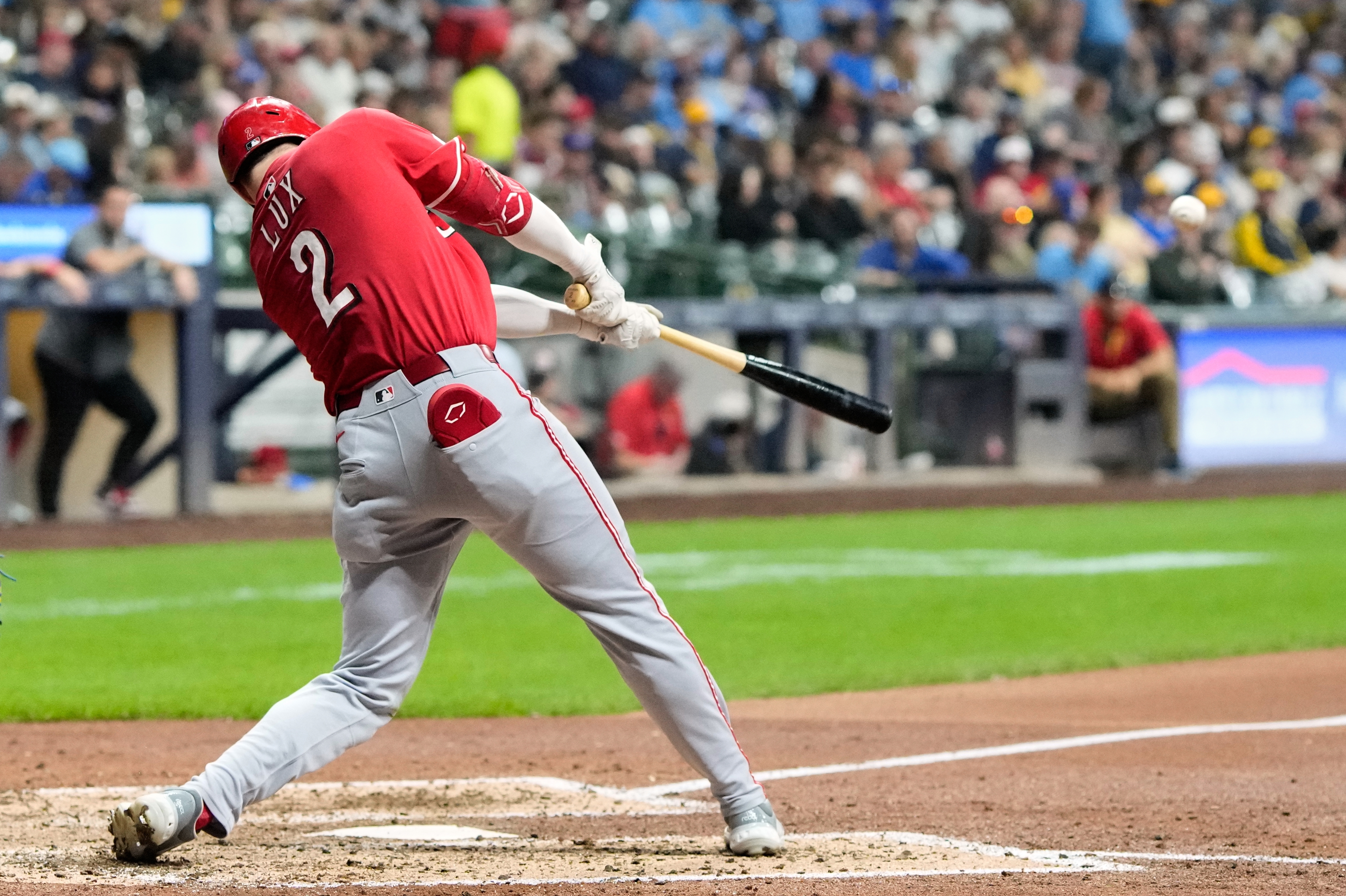 Cincinnati Reds' Gavin Lux hits a double during the sixth inning of a baseball game against the Milwaukee Brewers Friday, Sept. 26, 2025, in Milwaukee. (AP Photo/Morry Gash)