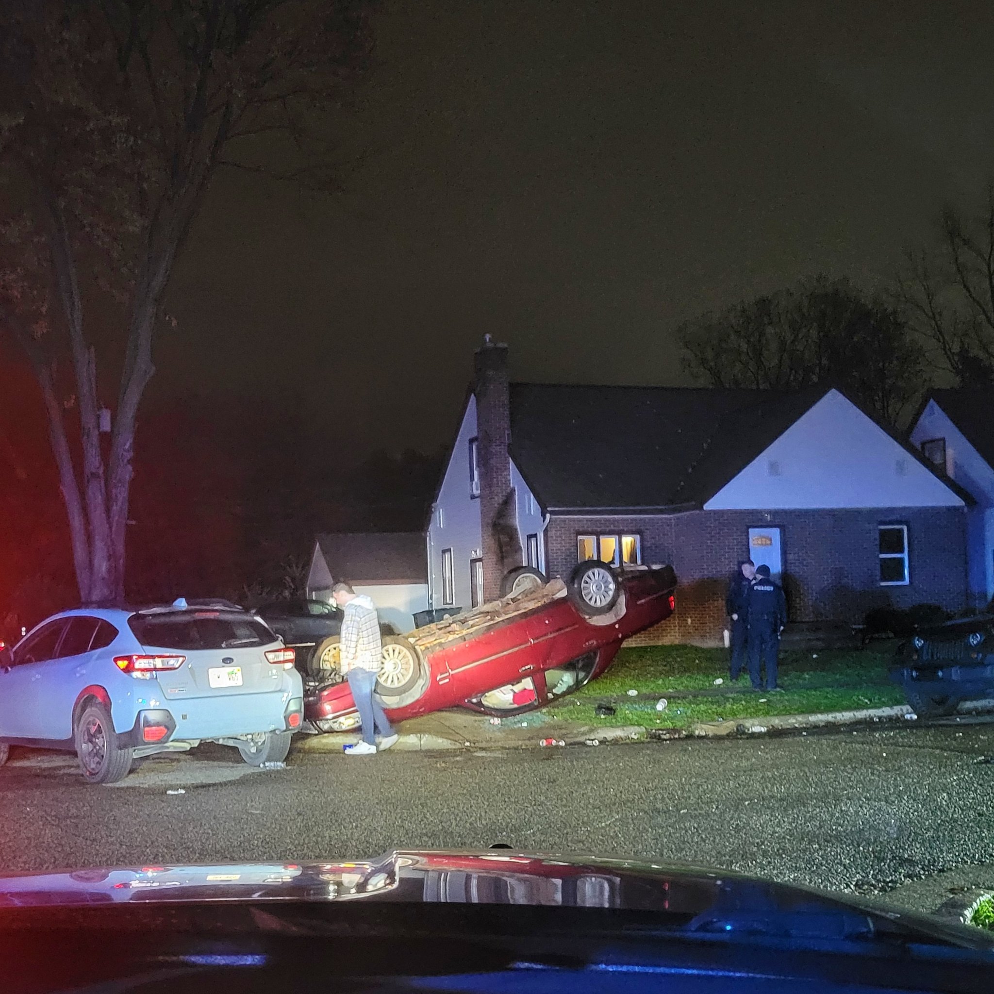 Flipped car in East Lansing after MSU's win over Michigan 