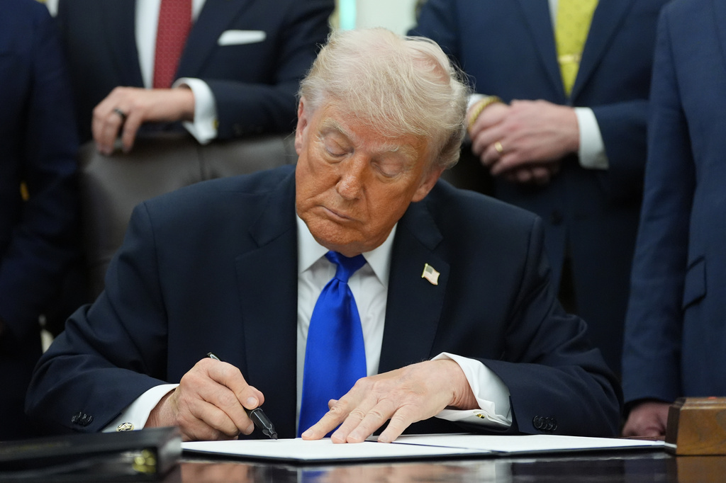 President Donald Trump signs a presidential permit regarding pipeline construction in the Oval Office of the White House, Thursday, April 30, 2026, in Washington