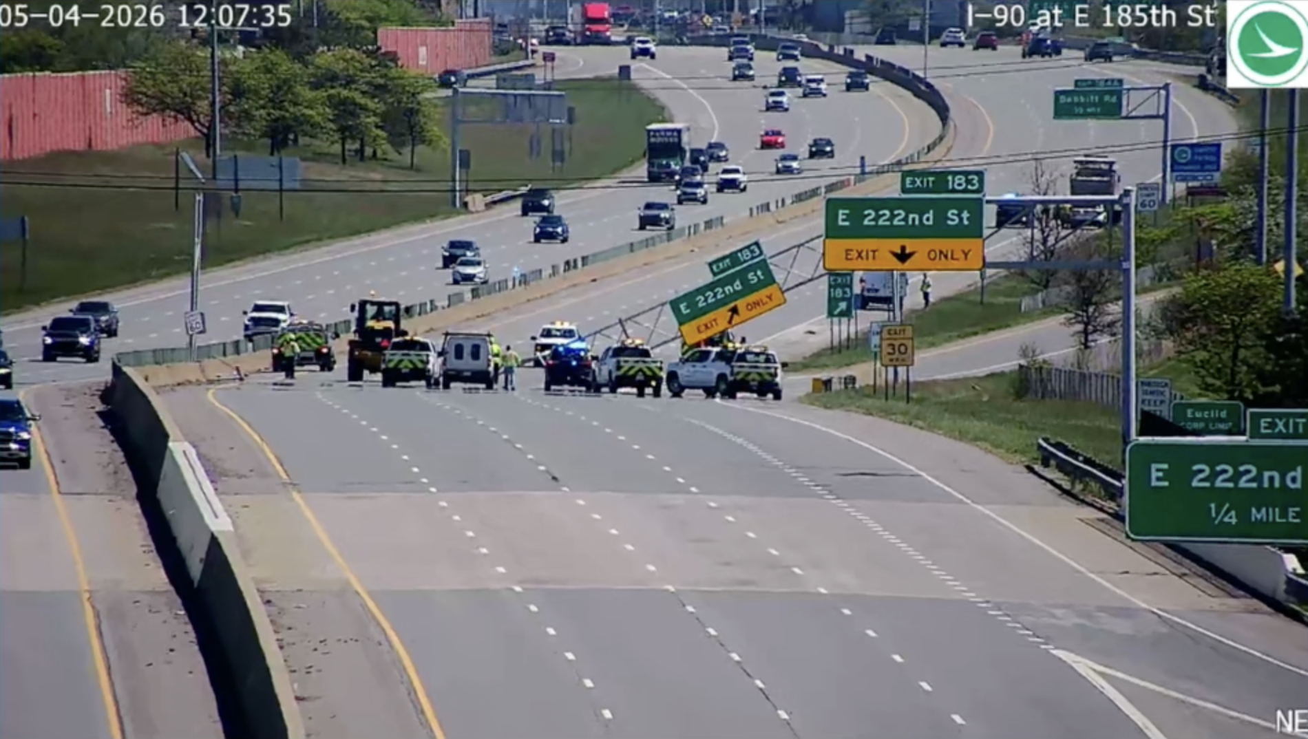 Dump truck with raised bed crashes into overhead sign
