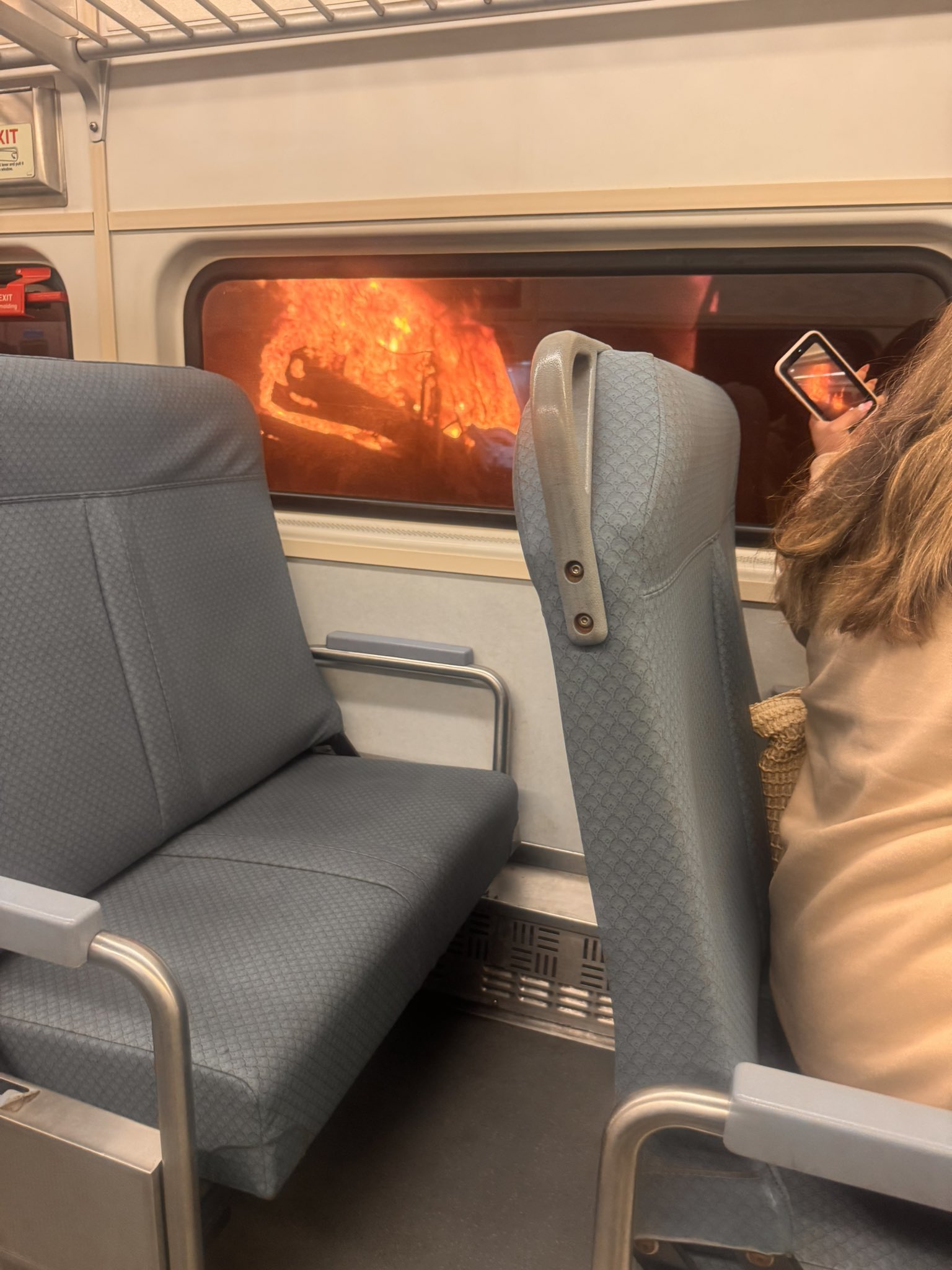 Fire seen outside a railcar.