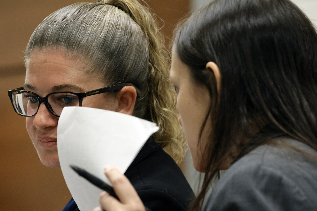 Kate O'Shea speaks with Nawal Bashimam during jury selection in penalty phase of Nikolas Cruz murder trial, June 23, 2022