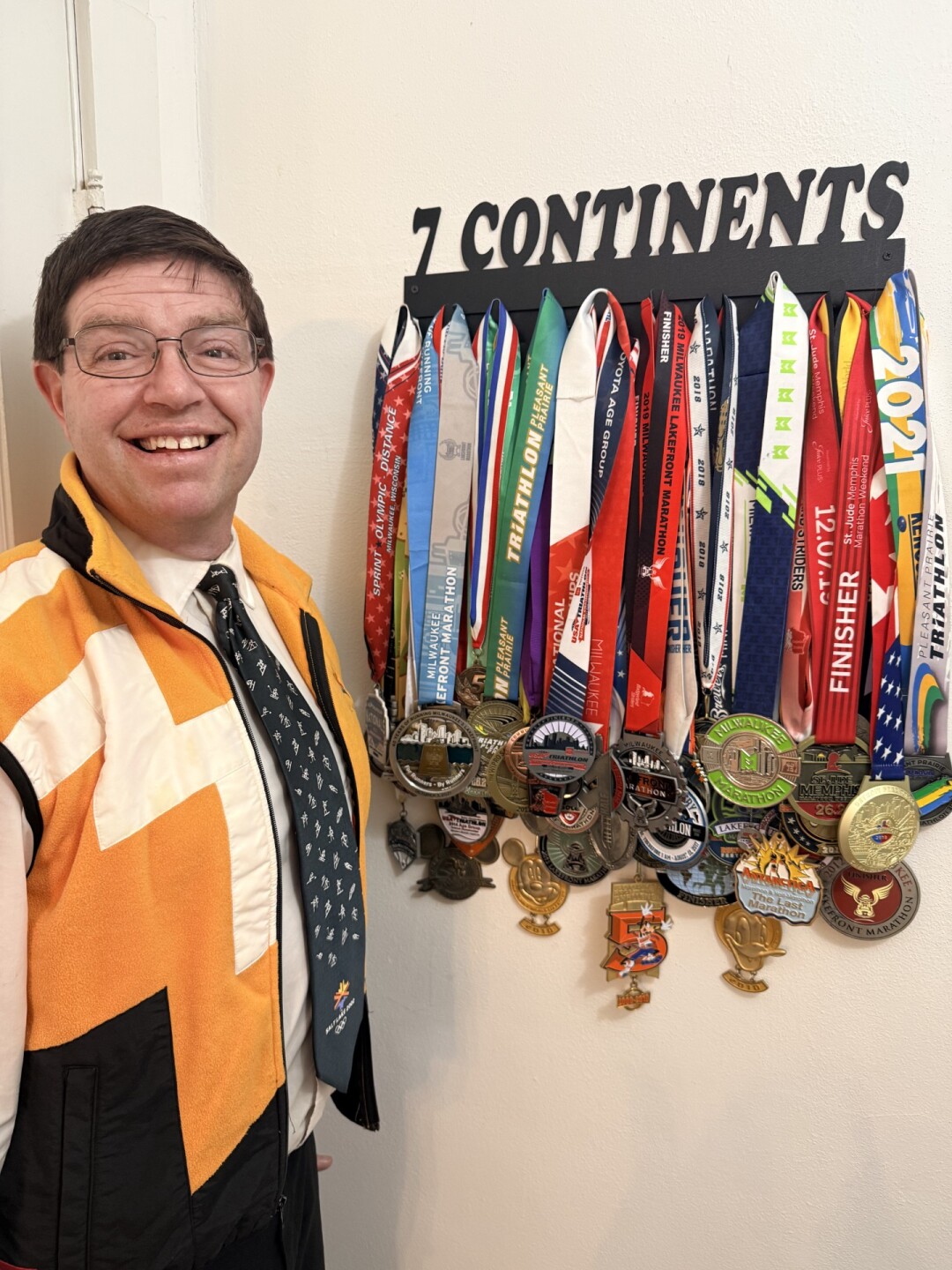 Chris with marathon medals