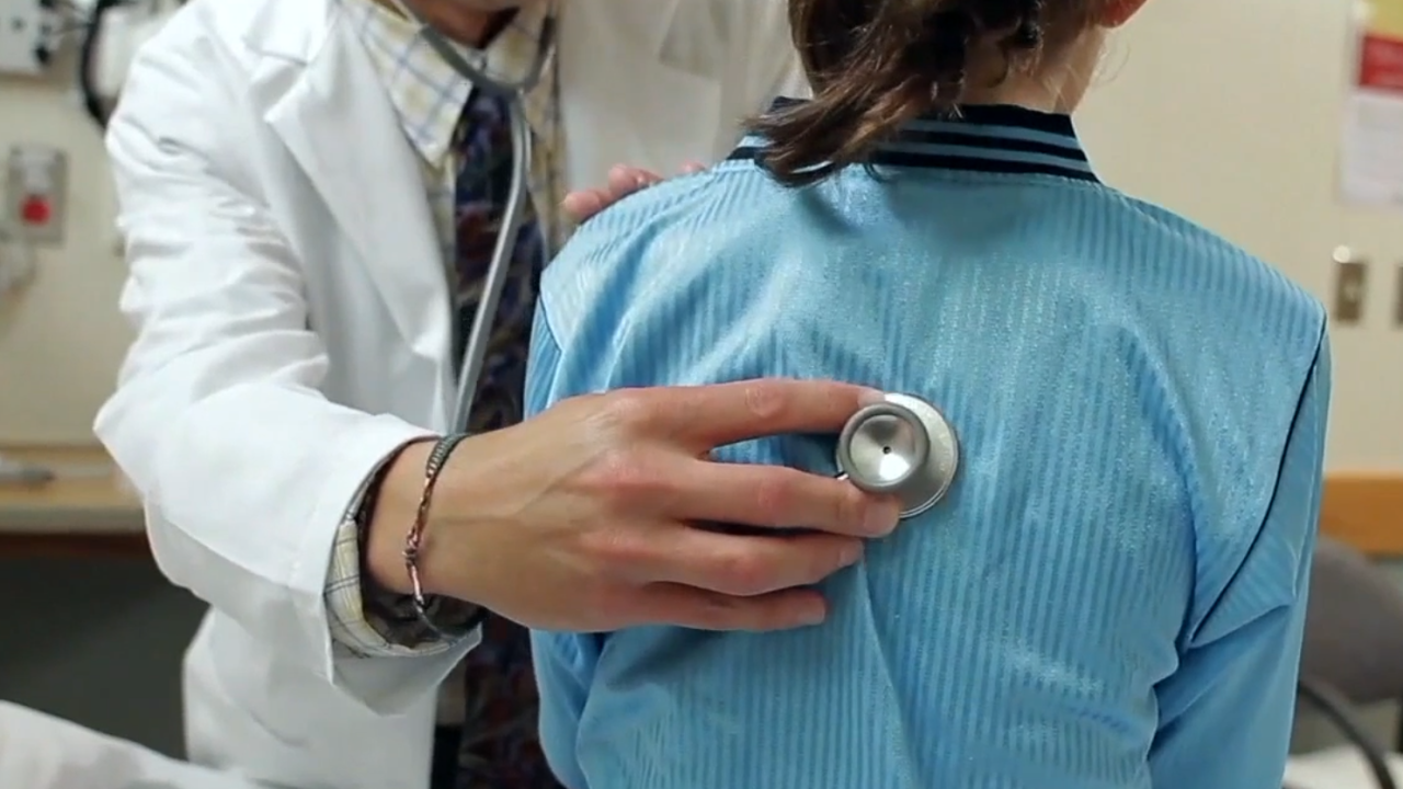 Doctor kid flu cases sick child