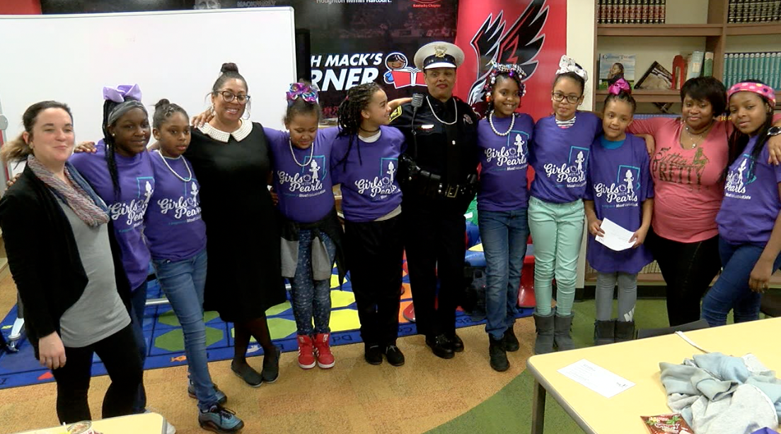 Girls with Pearls from Ethel M. Taylor Academy next to Cincinnati Police Officer Princess Davis
