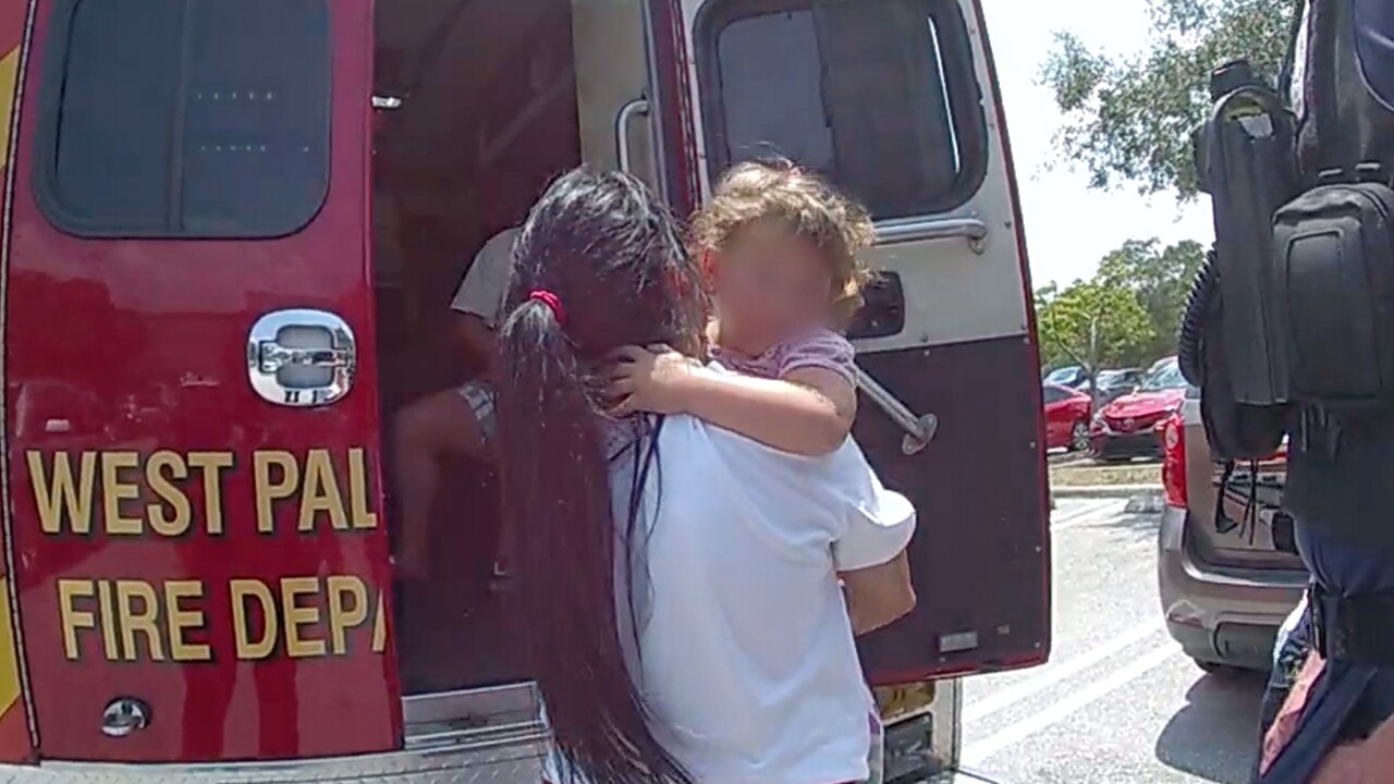 A 3-year-old girl is treated by paramedics outside a Sam's Club in West Palm Beach on May 11, 2024.jpg
