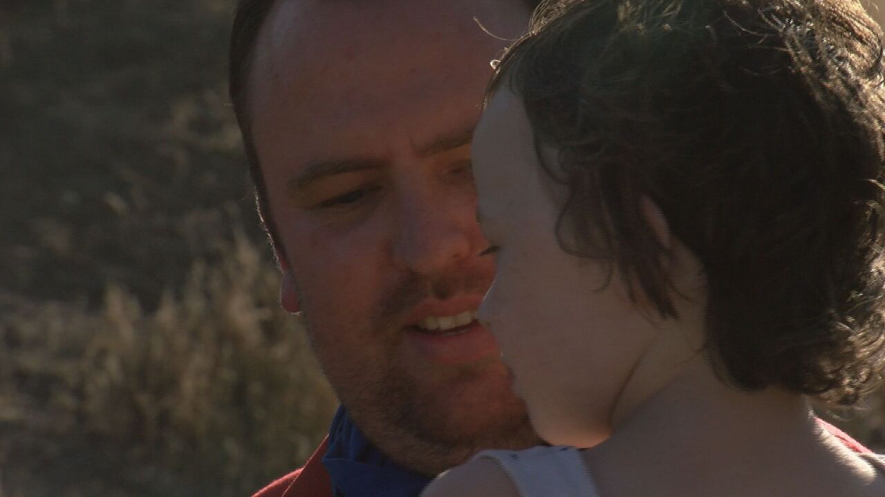 Peter holding his youngest daughter