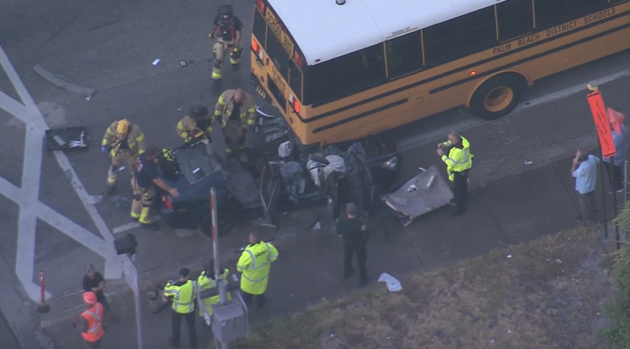 Chopper 5 view shows roof of car cut off after crashing into back of Palm Beach County school bus in Lake Worth Beach, Aug. 10, 2022