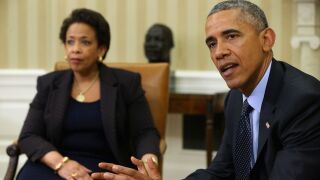 MAY 29: U.S. President Barack Obama (R) talks to members of the news media after meeting with Attorney General Loretta Lynch in the Oval Office at the White House May 29, 2015 in Washington, DC.