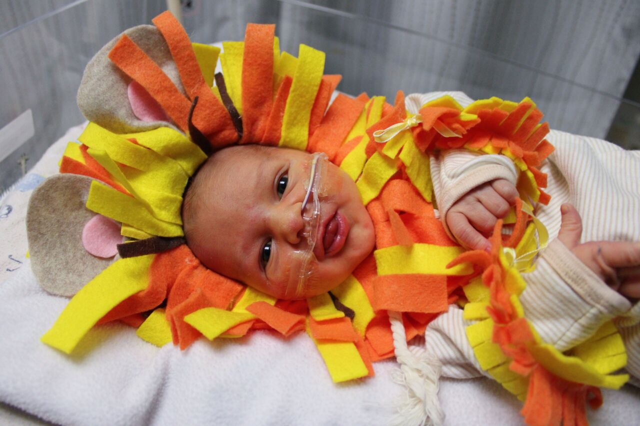 Baby in lion costume - Trinity Health Grand Rapids NICU.png