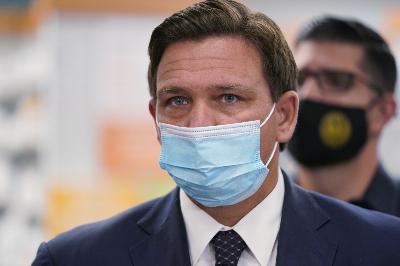 Gov. Ron DeSantis wearing mask at Navarro Discount Pharmacy in Hialeah, Feb. 23, 2021