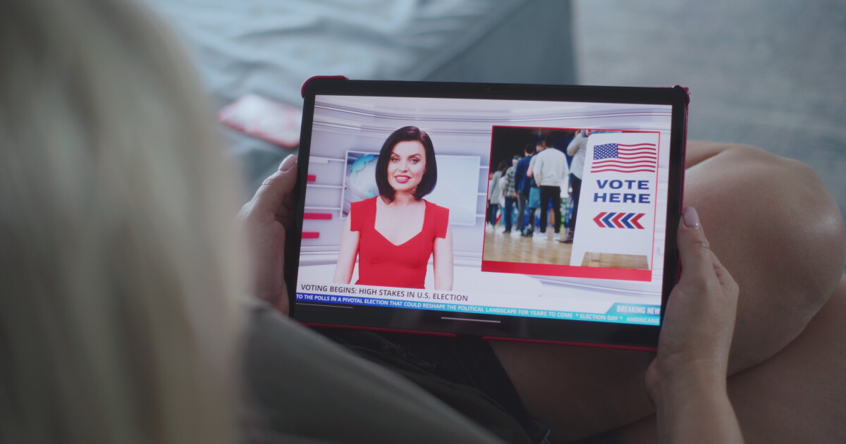 Photo: Scripps News A person watching an election ad