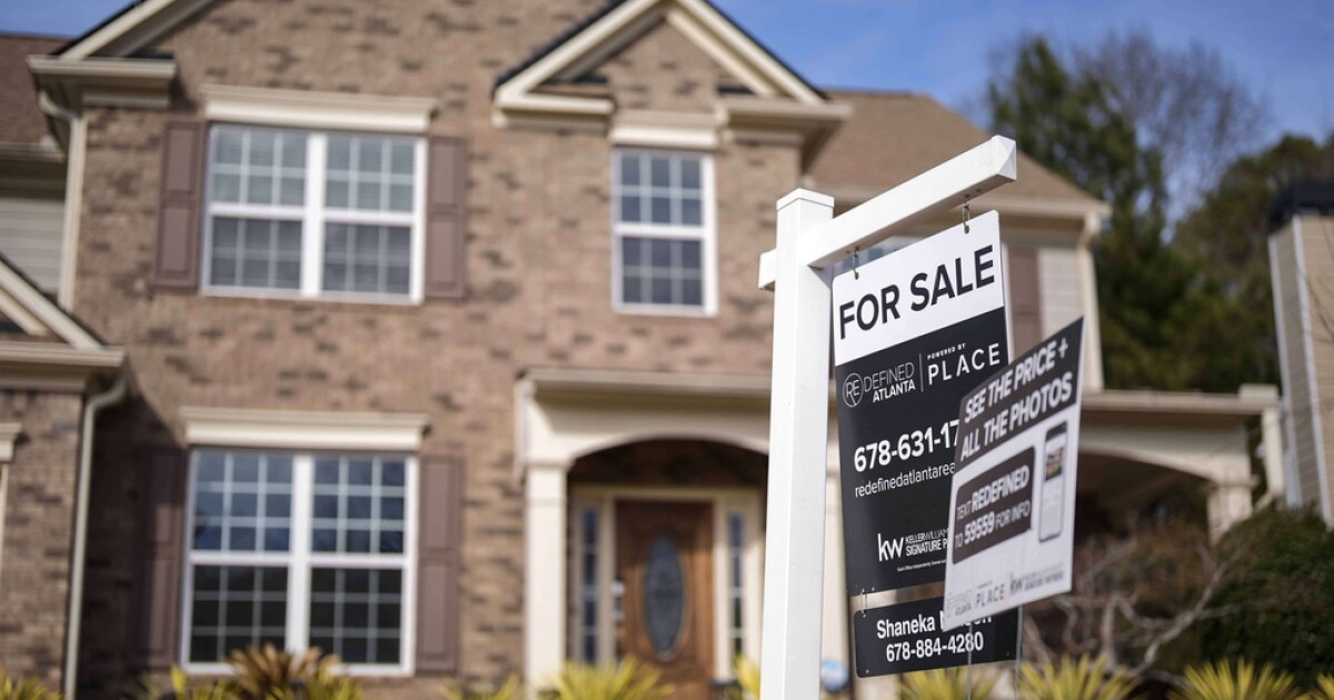 Photo: scrippsnews.com A for sale is displayed outside a home