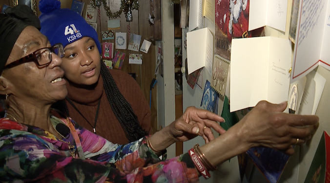 carrie miller showing hallmark cards.png