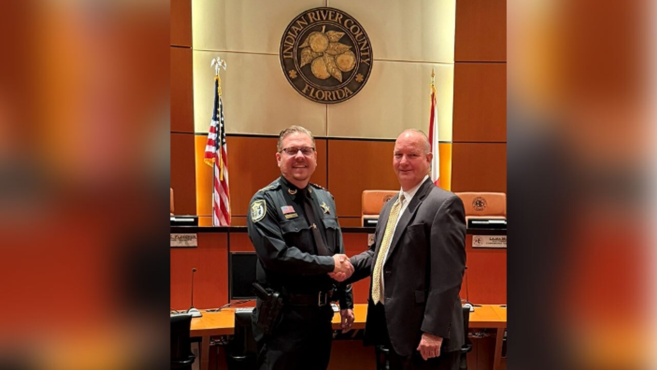 Indian River County Sheriff Eric Flowers and Board Chairman Deryl Loar shake hands on April 14, 2026.