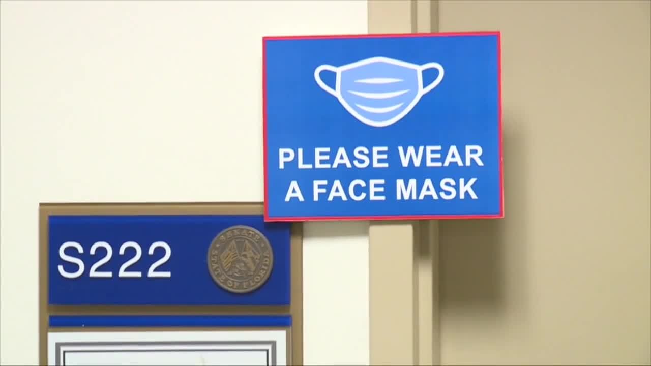 'Please Wear A Face Mask' sign on door to Sen. Tina Polsky's office