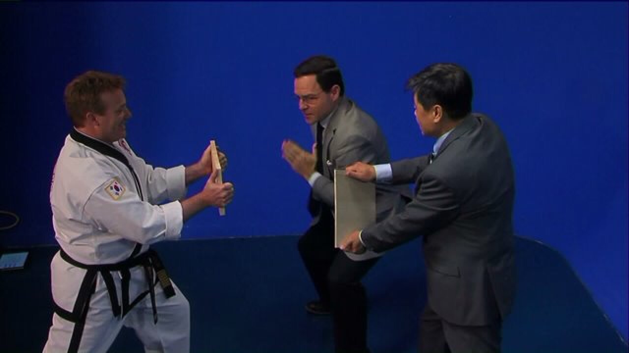 Grandmaster Dong helps Greg McQuade master the art of breaking boards
