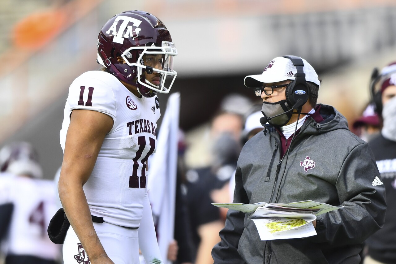 Texas A&M Aggies QB Kellen Mond speaks to Jimbo Fisher on sideline at Tennessee Volunteers in 2020