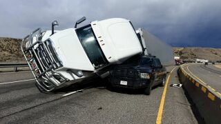 Deputy injured when semi truck got blown over onto patrol vehicle