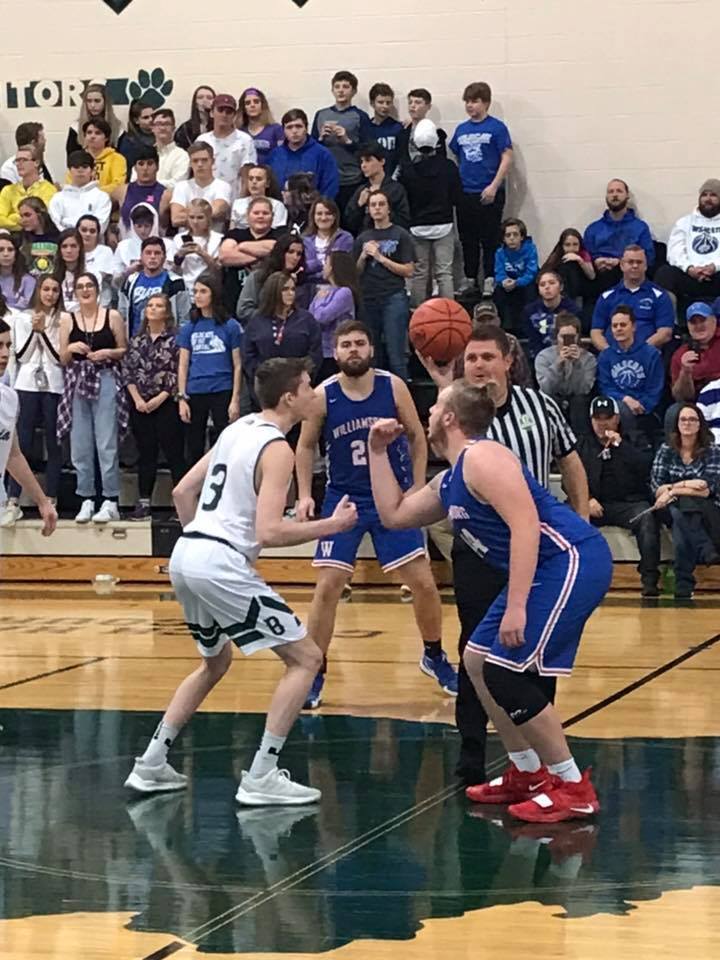 Batavia's Nate Watson (left) in the season opener against Williamsburg. (Photo by Ashly DeTellem)