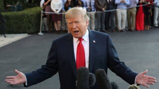 President Donald Trump talks to the media