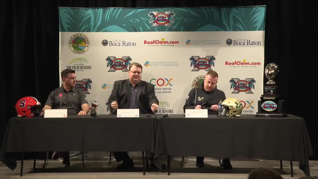 Doug Mosley, executive director of Boca Raton Bowl, with Syracuse Orange interim head coach Nunzio Campanile and USF Bulls head coach Alex Golesh, Dec. 17, 2023