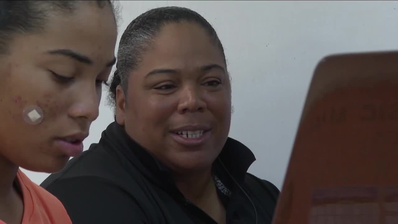 Sherry Pla watches her daughter Staci Pla play piano