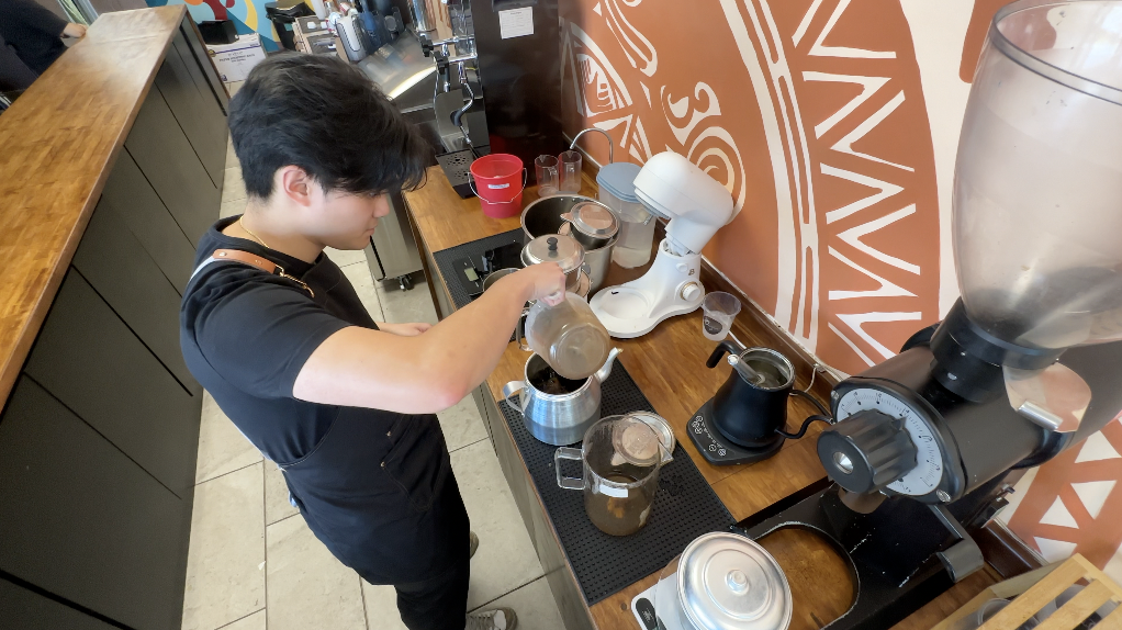 Making coffee at Origin Coi Won Coffee House
