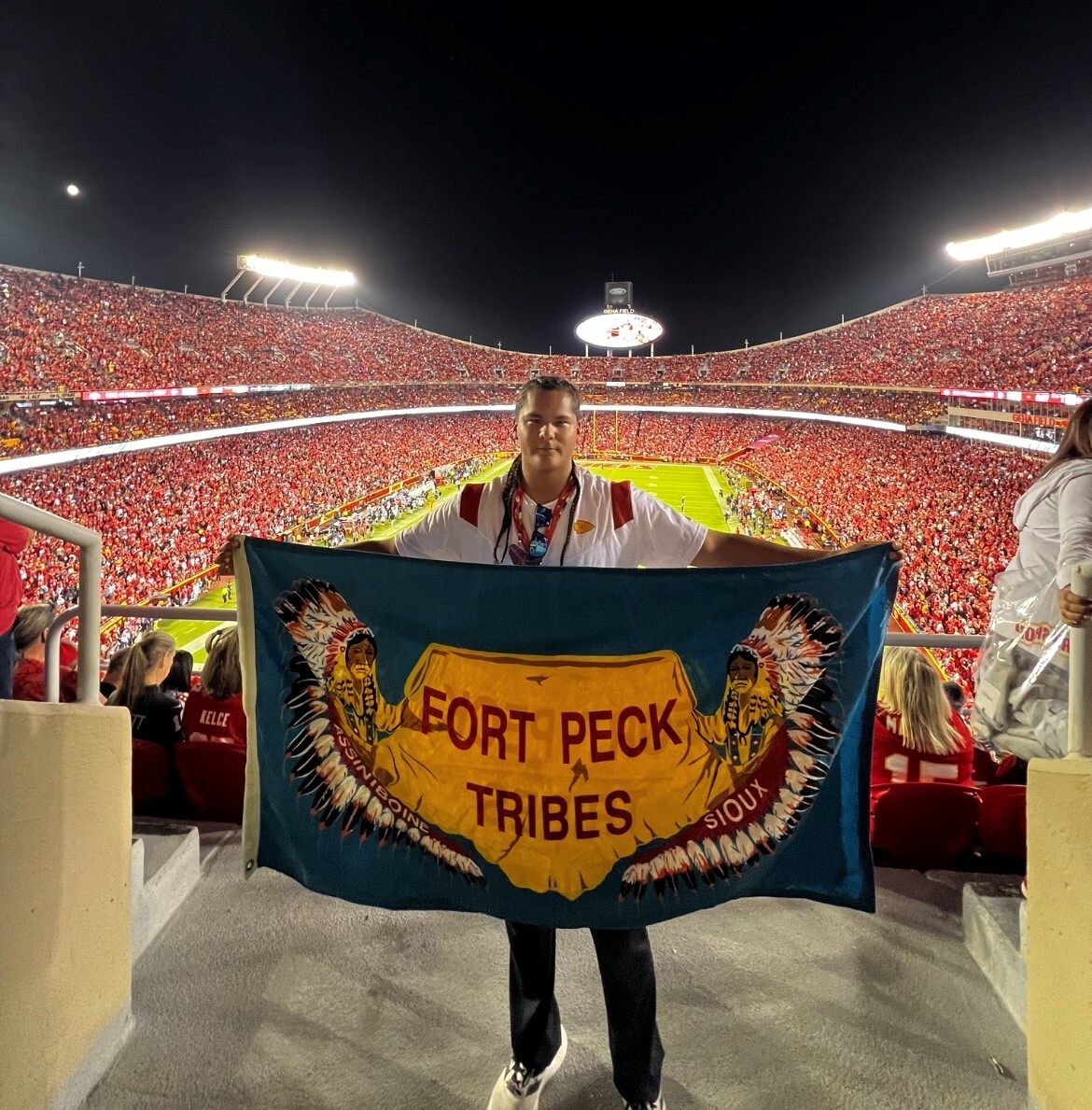 MB with tribal flag during game on Indigenious Peoples Day.jpg