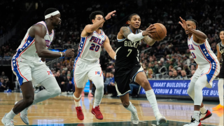 Milwaukee Bucks' Kevin Porter Jr. (7) drives to the basket against Philadelphia 76ers' Jabari Walker, right, Jared McCain (20), and Adam Bona during the first half of an NBA basketball game, Friday, Dec. 5, 2025, in Milwaukee.