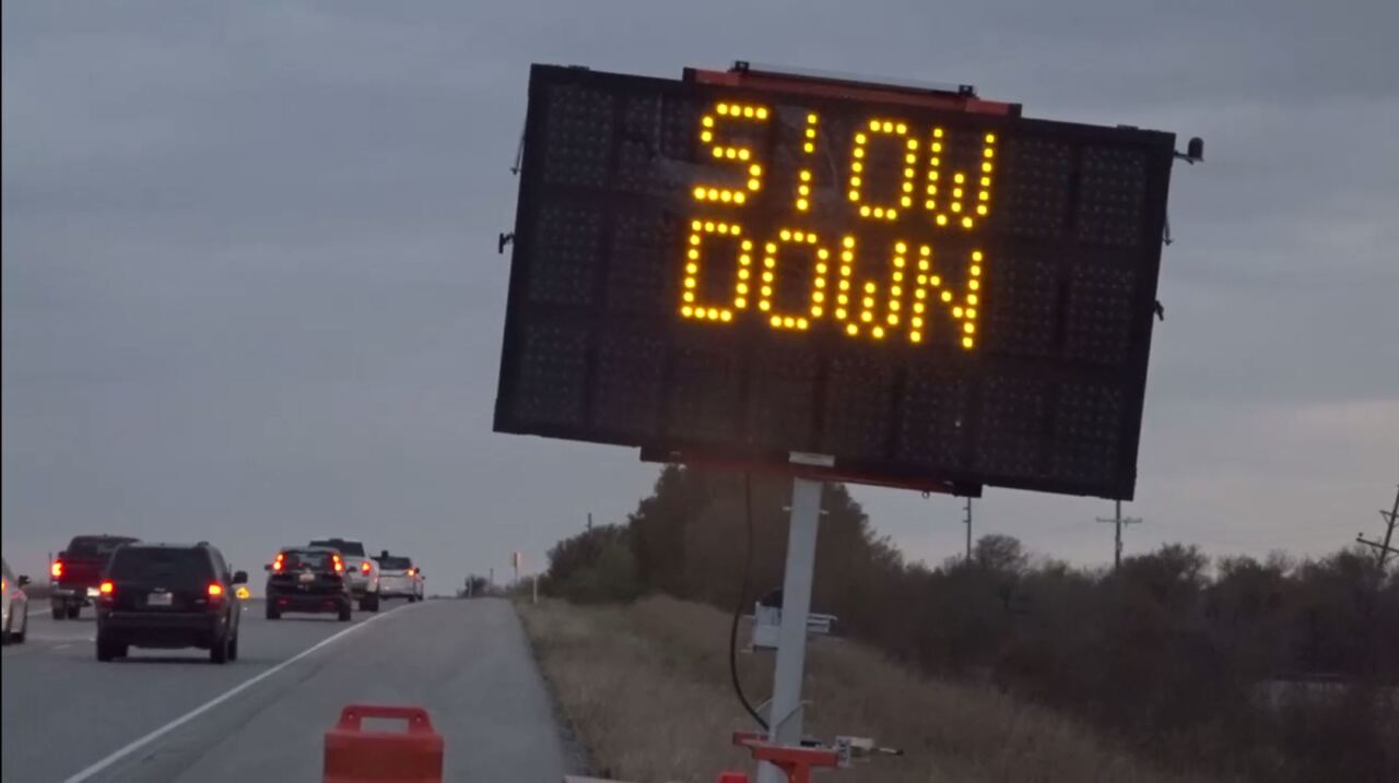 Slow down sign