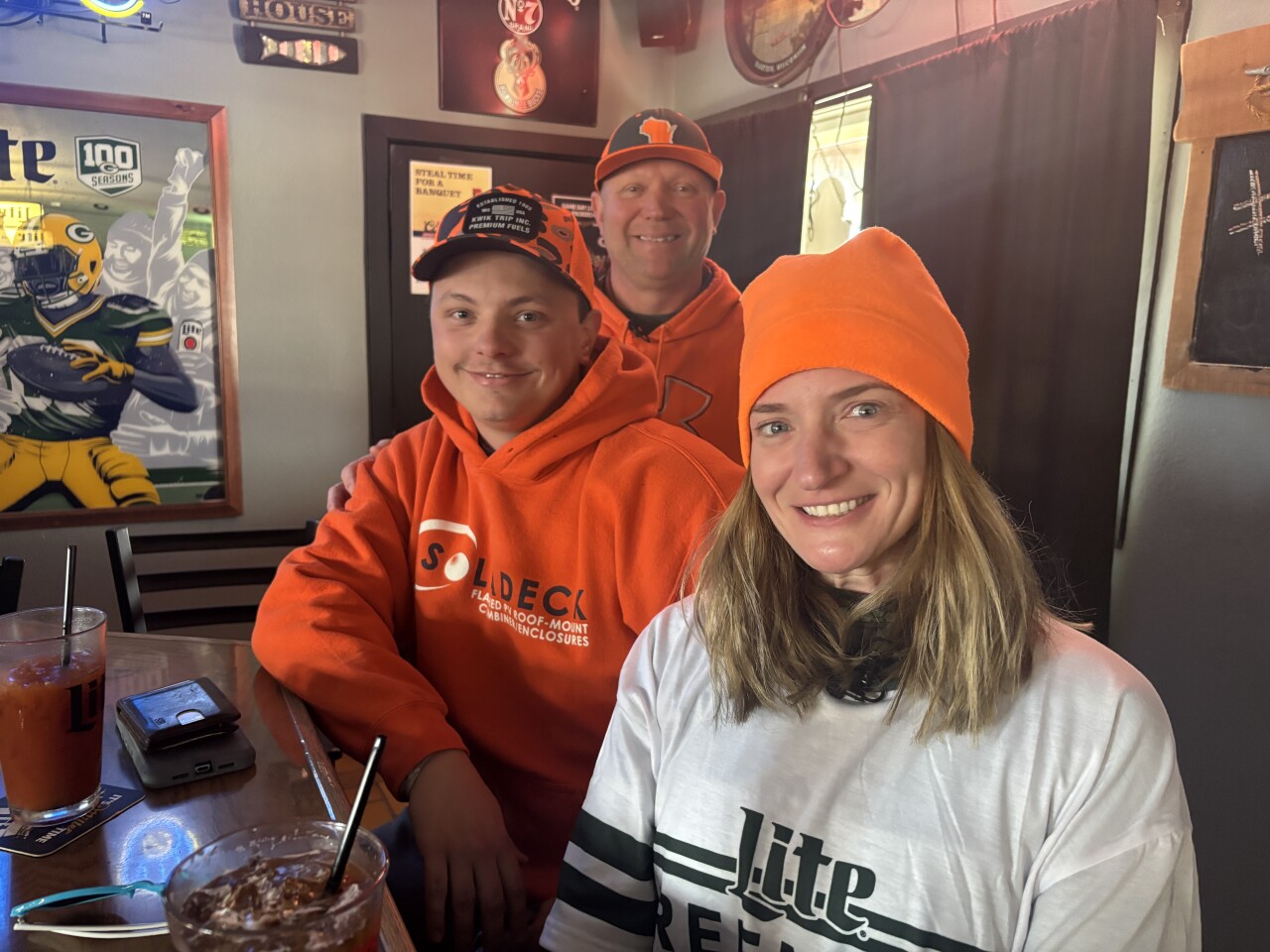 Casey Capozzi, Brad and Calissa Sorenson celebrate Thanksgiving by hunting then stopping at Eddie's Lake House Bar in West Bend