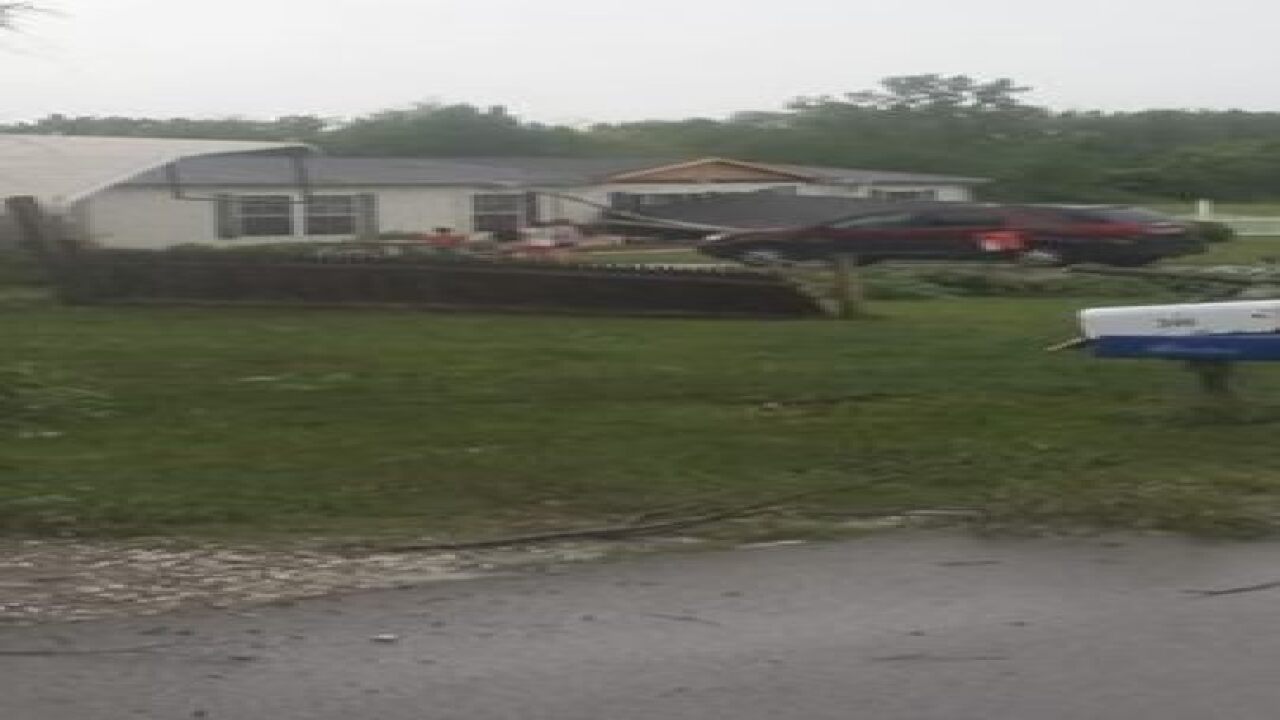 PHOTOS: Ominous skies and storm damage