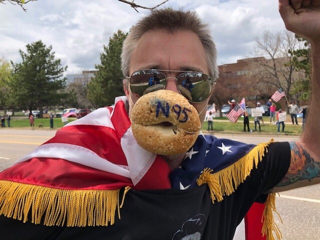 Protester wearing bagel face mask