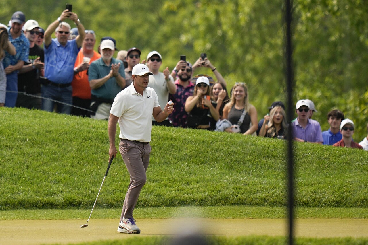 Brooks Koepka waves after his putt on the third hole during the final round of the PGA Championship golf tournament at Oak Hill Country Club on Sunday in Pittsford, N.Y.