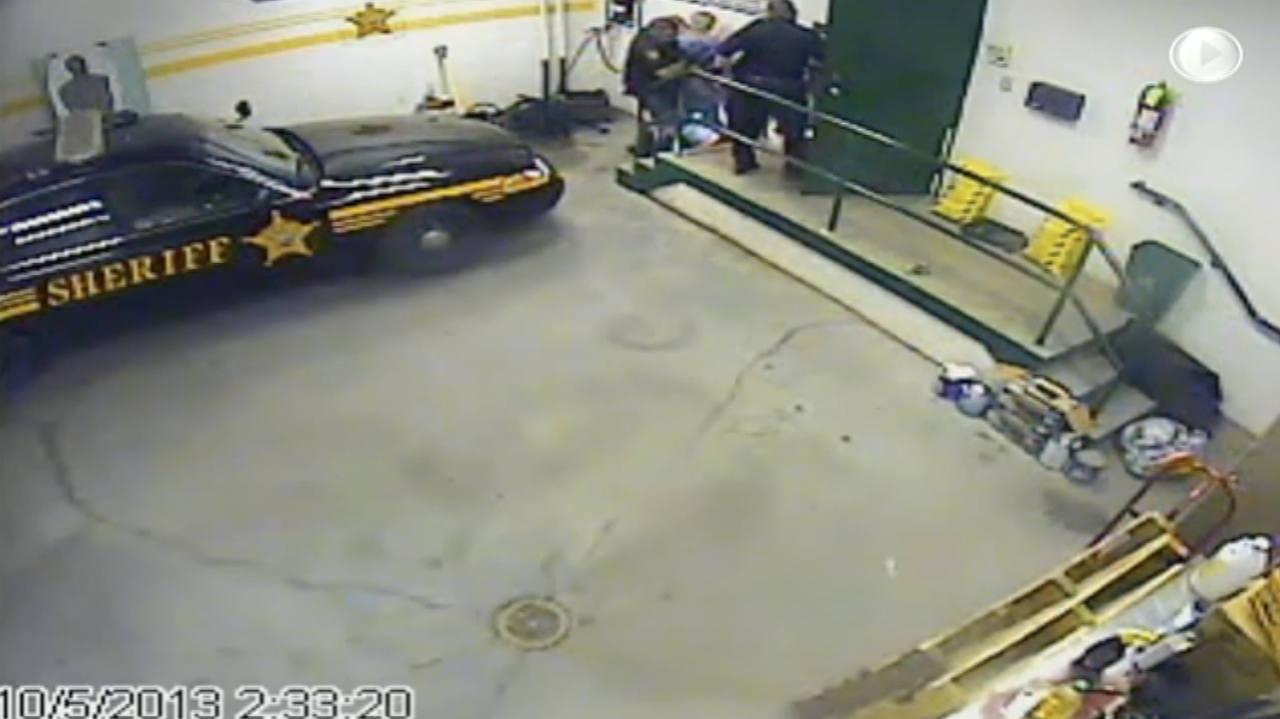 Brown County Sheriff's deputies bring Zachary Goldson into jail on Oct. 5, 2013.