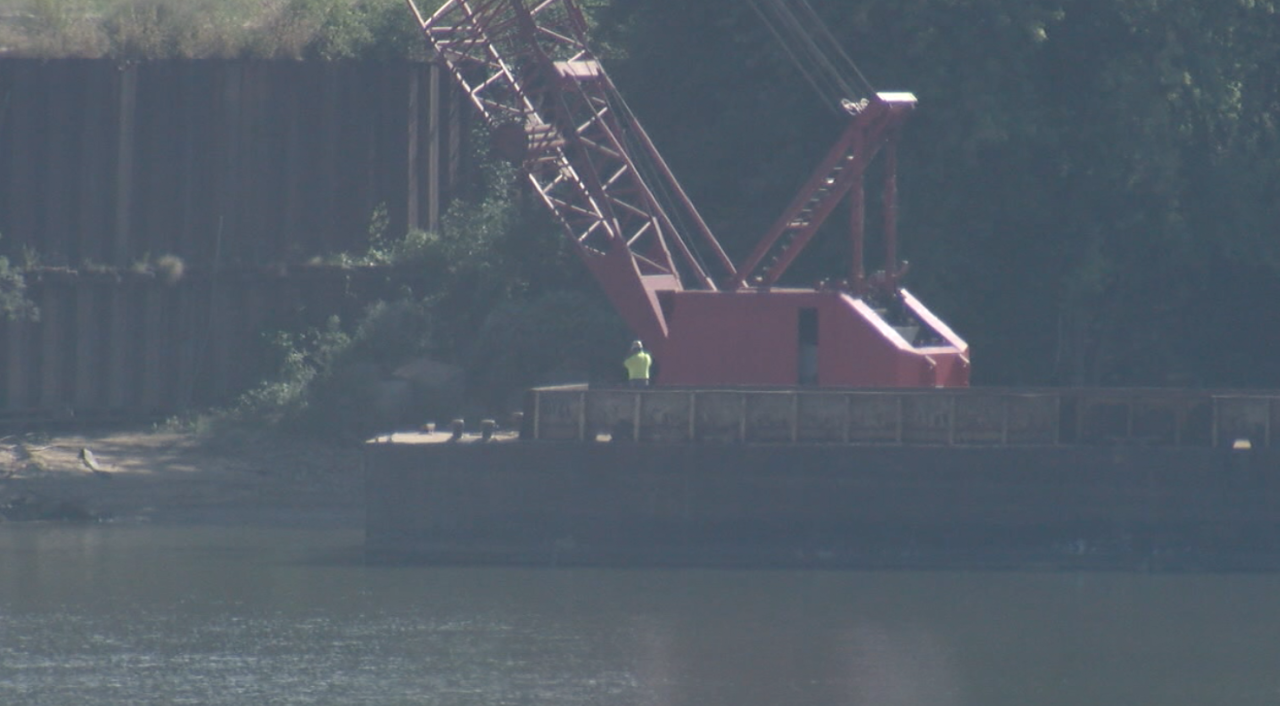 Crews work on barge-mounted crane at Beckjord on Sept. 17, 2021.
