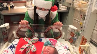 Elf visiting NICU baby