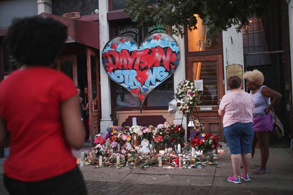 People congregate around a memorial to those killed in Sunday morning's mass shooting on Aug. 6, 2019 in Dayton, Ohio (Scott Olson/Getty Images).